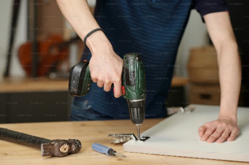 A man drilling